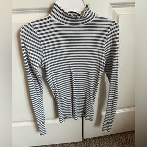 cute tight fit top. good for layering. easy to dress up or down for any event!